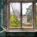 Old window in an abandoned interior