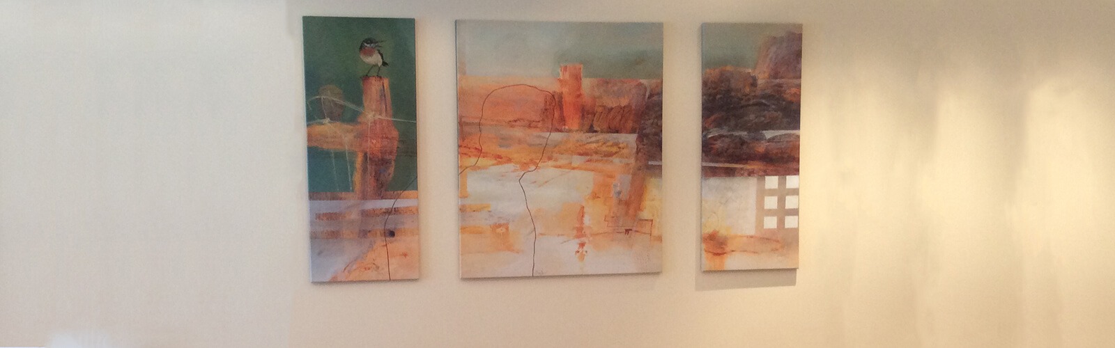 Multi-panel artwork displayed on a bright wall
