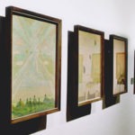 Framed artworks with specialist picture glass in a gallery